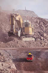 Big shovel loading of copper ore near to pickup truck © Luis Sandoval M.