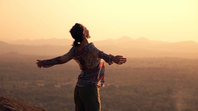Young woman enjoying sunset and landscape standing on hill, super slow motion 240fps
