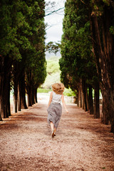 Fototapeta na wymiar happy woman walk in forest