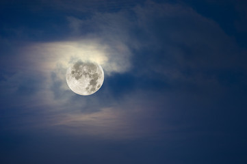 Naklejka na ściany i meble Full moon and cloudy sky