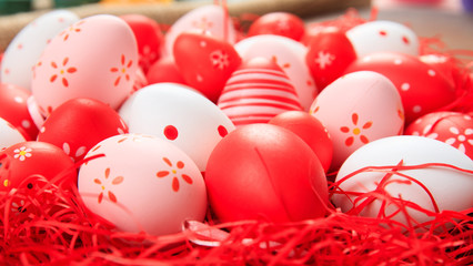 Easter eggs on straw background