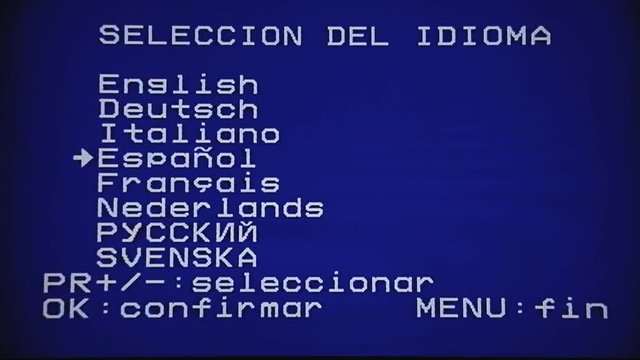 Setting the English language on a VCR VHS player recorder. Other menu choices: German, Italian, Spanish, French, Dutch, Russian, Sweden. White characters on blue background.
