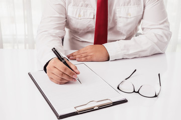 filling resume on wooden table