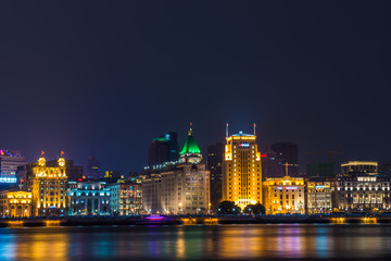 Night view of River Boats on the Huangpu River and as Background the Skyline of the Northern Part of Puxi 