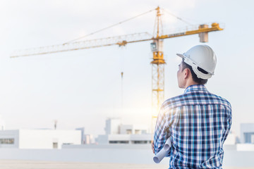 Portrait of engineer wear white helmet safety on construction site with crane background