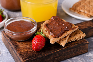 crackers spread with Chocolate Hazelnut Filling and Strawberries