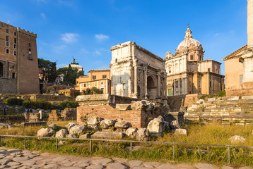 Rome, Italy. Ruins of Rostra and the triumphal arch of Septimius Severus at the Roman Forum, 205.