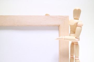 Wood mannequin and Picture frame on white background Character space