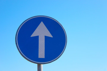 Arrow road sign direct way on a sky background