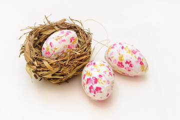 Naklejka na ściany i meble shabby chic Easter eggs in nest isolated on white background 