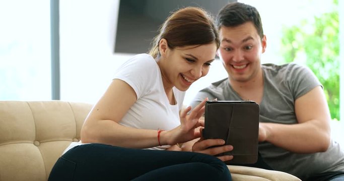 Young Couple using interent on digital tablet
