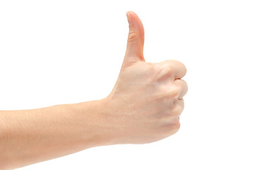 hand of young girl shows thumb up.