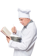 Chef with cookbook and pan for soup on a white background