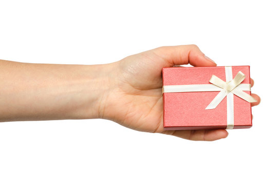 hand of young girl holding gift box.