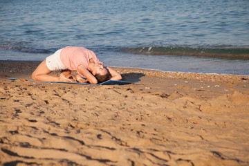 the girl is engaged in fitness and yoga