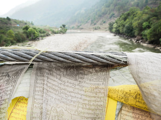 Amulet Fabric hanging on the bridge - Bhutan