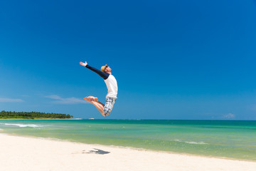 man jump on beach
