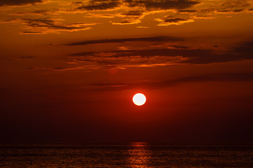 red sunset over water