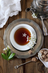 Vintage style: romantic tea drinking with jasmine tea. Top view