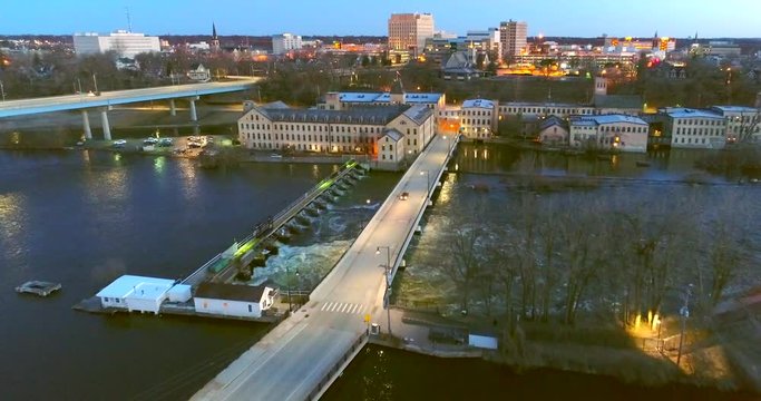 Stunning twilight aerial view of historic waterfront buildings, bridge, in Appleton, Wisconsin.