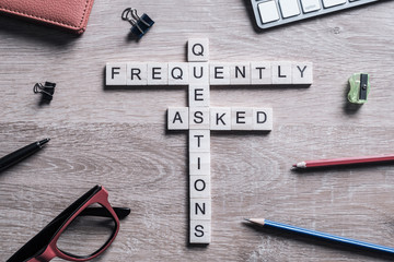 Frequently Asked Questions concept collected of wooden cubes on 