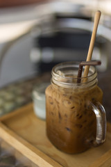 Thai Iced coffee with milk in a glass mason jar.