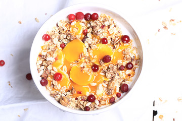 Breakfast granola with cranberries banana and mango mousse