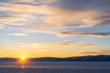 Outdoor view of frozen baikal lake in winter during sunset