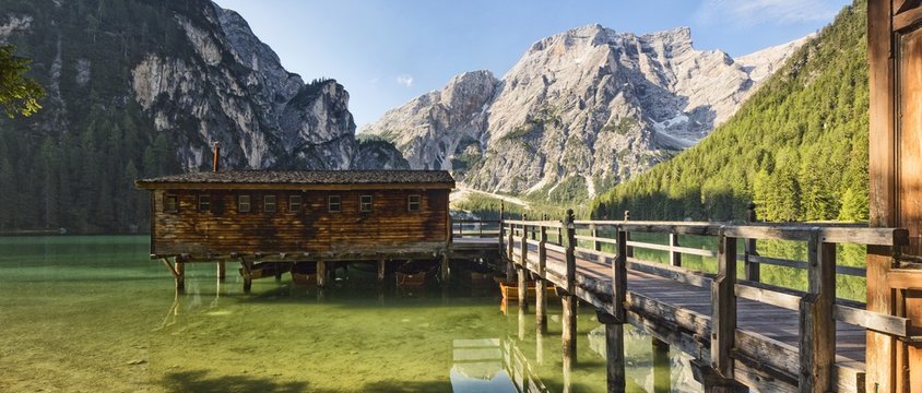 Palafitte on Braies Lake (Pragser Wildsee) and in the background Croda del Becco mountain (Seekofel), Dolomites, South Tyrol, Italy