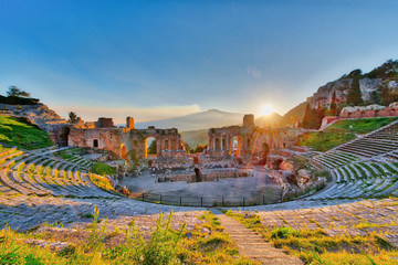 Ancient theatre of Taormina with Etna erupting volcano at sunset - 141595007