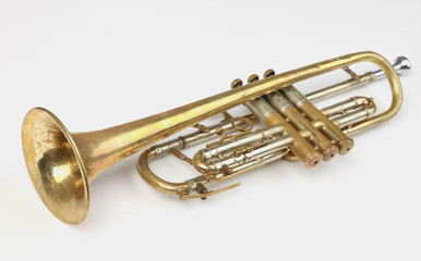 old trumpet on white background