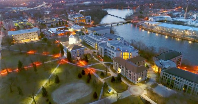 Stunning twilight aerial view of historic riverfront buildings, bridge, in Appleton, Wisconsin.