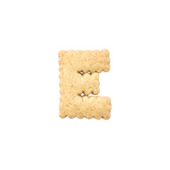 Closeup brown cookie in E english alphabet isolated on white background with clipping path