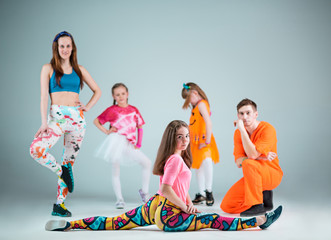 Group of man, woman and teens dancing hip hop choreography