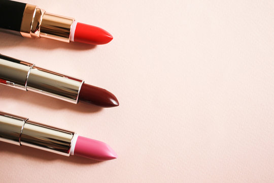 Lipsticks on a beige background