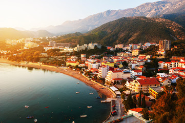 Fototapeta na wymiar Montenegro at sunset. Aerial view of coastal town Rafailovici