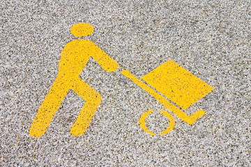 Loading goods urban symbol on asphalt road - toned image