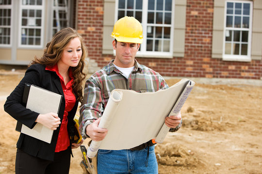 Construction: Architect Reviews Plans with Contractor
