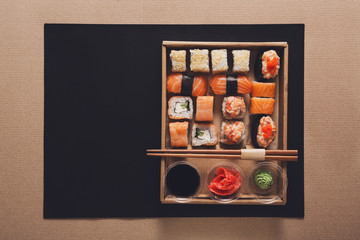 Set of sushi maki and rolls in carton delivery box