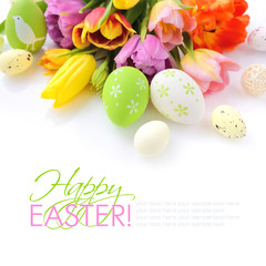 Easter eggs with tulips flowers on white background