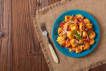 Delicious tortellini with meat in tomato sauce.