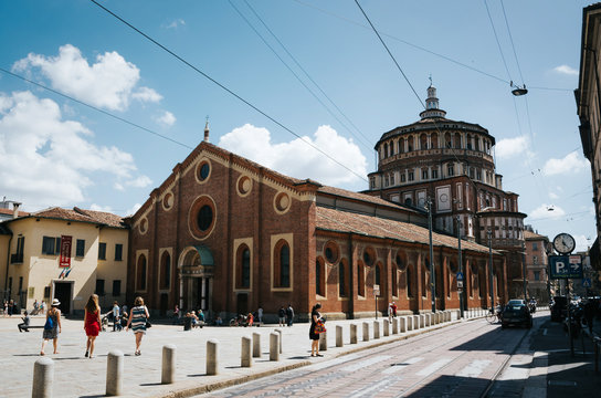 MILAN, ITALY - JULY 17, 2016: People walk in front of Church and Dominican Convent of Santa Maria delle Grazie with "The Last Supper" by Leonardo da Vinci.