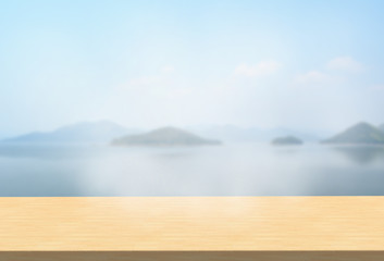Laminate table top on blurred mountains landscape background can put or montage your products