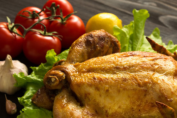 baked chicken on lettuce leaves