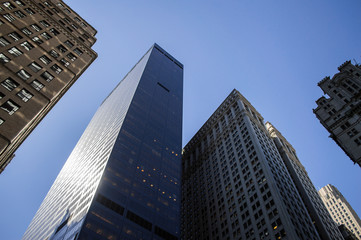 Fototapeta na wymiar Interesting Framing – Looking up between Skyscrapers in Manhattan, USA