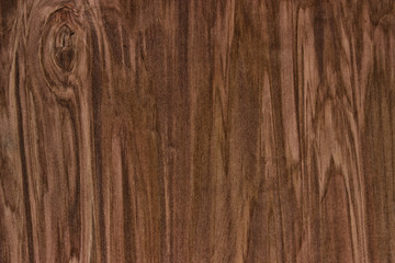 Dark brown scratched wooden cutting board. Wood texture background