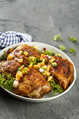 Chicken drumstick with fruit salsa
