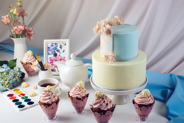 Spring morning still life cake in pastel colours with flowers