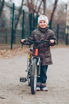 Little girl ride a bicycle
