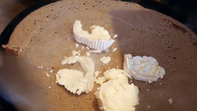 4K close up of a French traditional food specialty: A crepe, or buckwheat pancake with goat cheese in a cr&ecirc;perie restaurant, in Brittany. Galettes bretonnes ch&egrave;vre, creperie, Rennes, Bretagne, France.